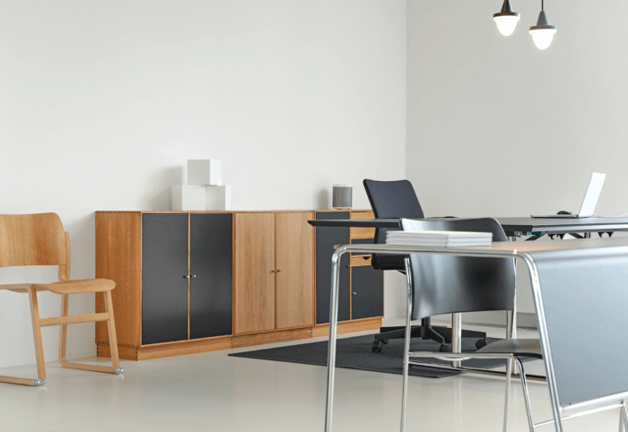 Desks and cupboards sit in a room of a modern office