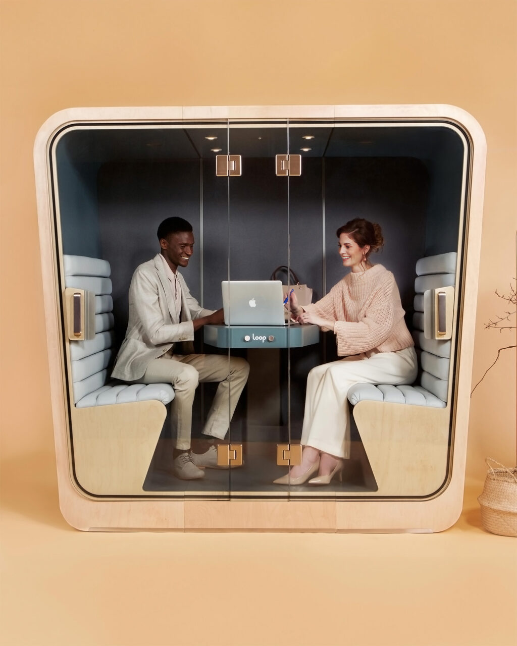 Two People meeting in a loop cube office privacy pod
