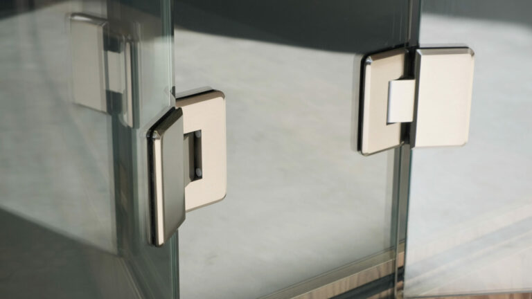 silver stainless steel hinges of a loop cube privacy pod