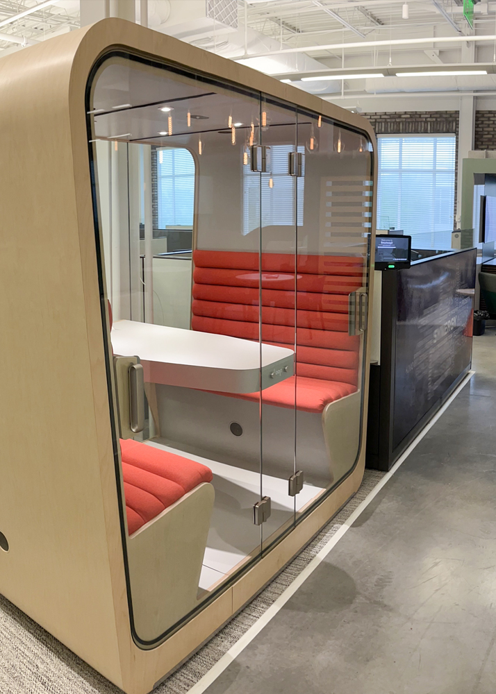 Loop Cube office pod in the hallway of a modern office